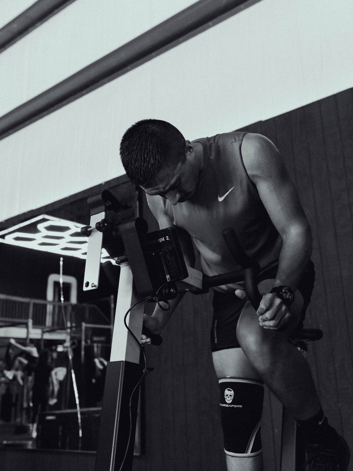 A MOB Fitness athlete catching his breath after a hard bike interval
