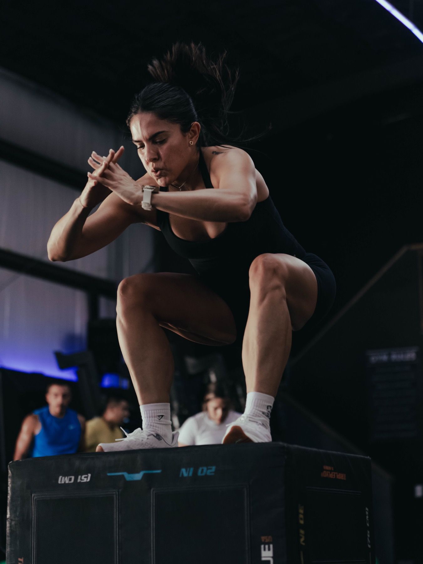 A MOB Fitness athlete completing a box jump
