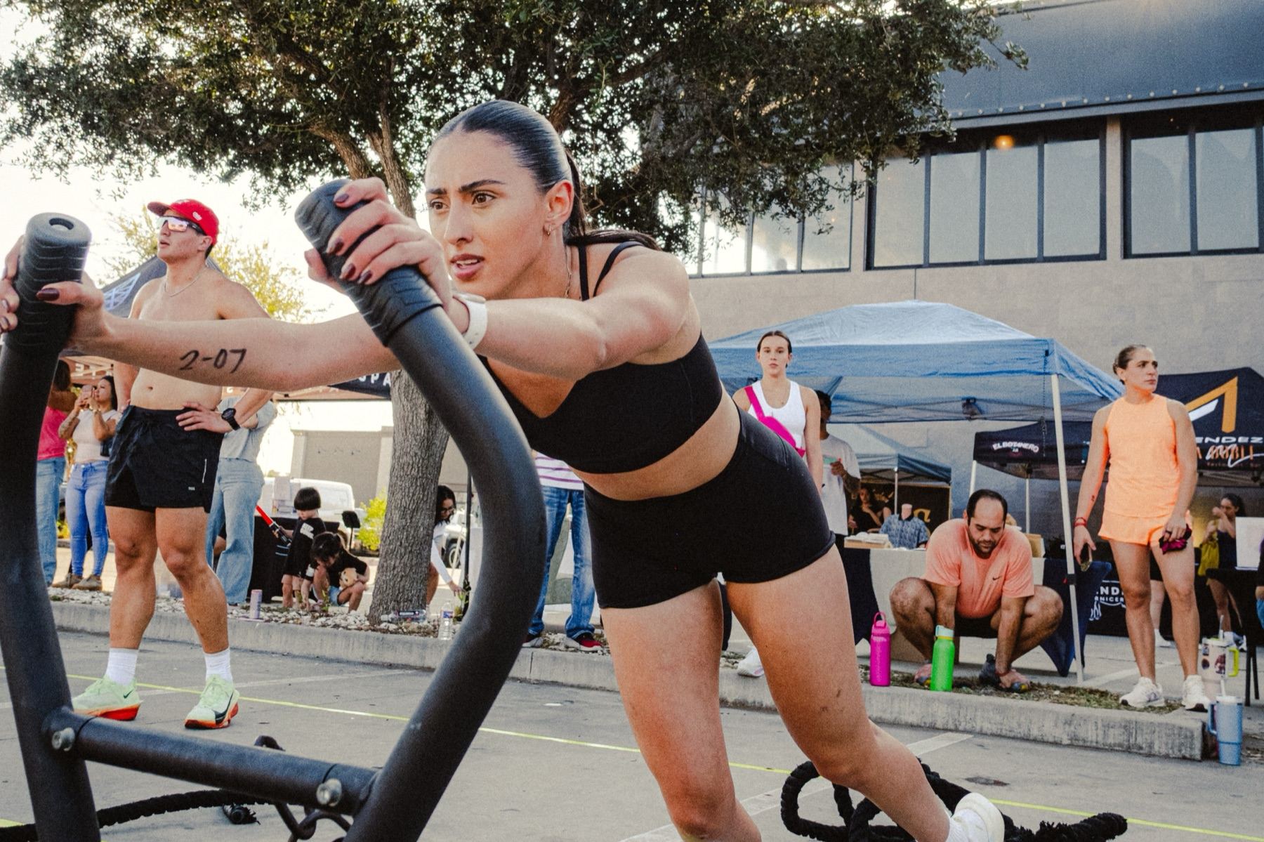 A MOB Fitness athlete pushing a weighted sled