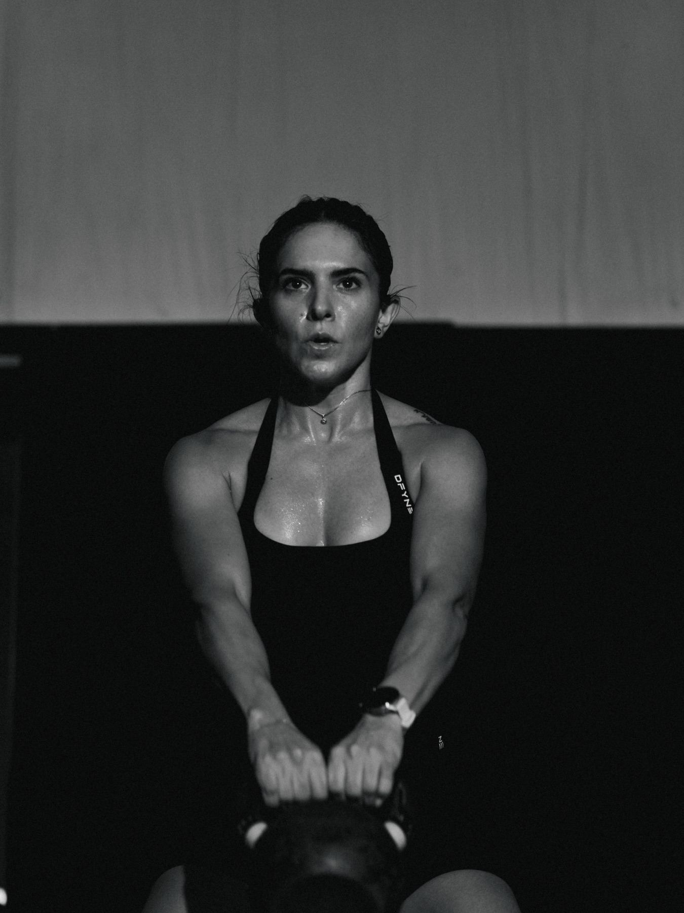 A MOB Fitness member training with a kettlebell